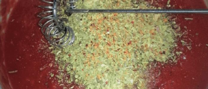 Mybusyretiredlife.com homemade pizza sauce Spices in the sauce whisk to incorporate