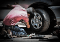 Working safe under a car Working on car jacked up