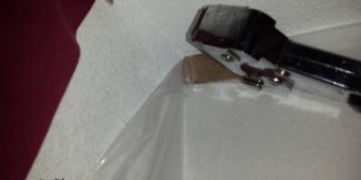 prepping for drywall texturing Plastic wrapped over the cardboard and tacked to the wall using a hammer tacker