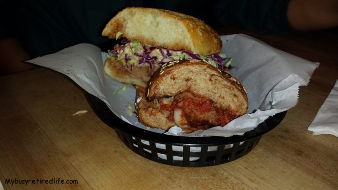 The Ravioli House Review Meatball on wheat foreground and Pulled Pork on Sourdough in the background