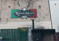 The Ravioli House Review Sign over the back door