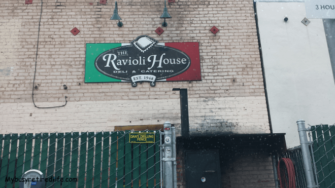 The Ravioli House Review Sign over the back door
