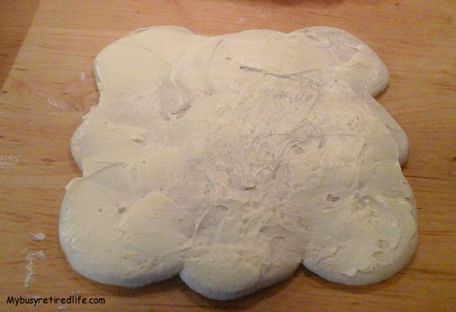 No Sugar Added Cinnamon Rum Raisin Rolls soft butter spread on biscuits