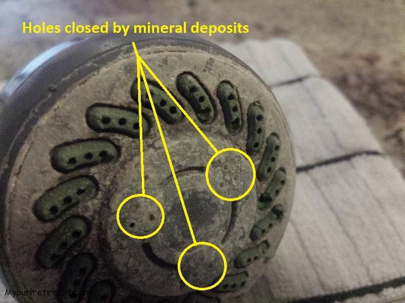 Shower head with mineral deposits