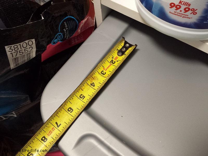 Bin Extends Beyond Cabinet